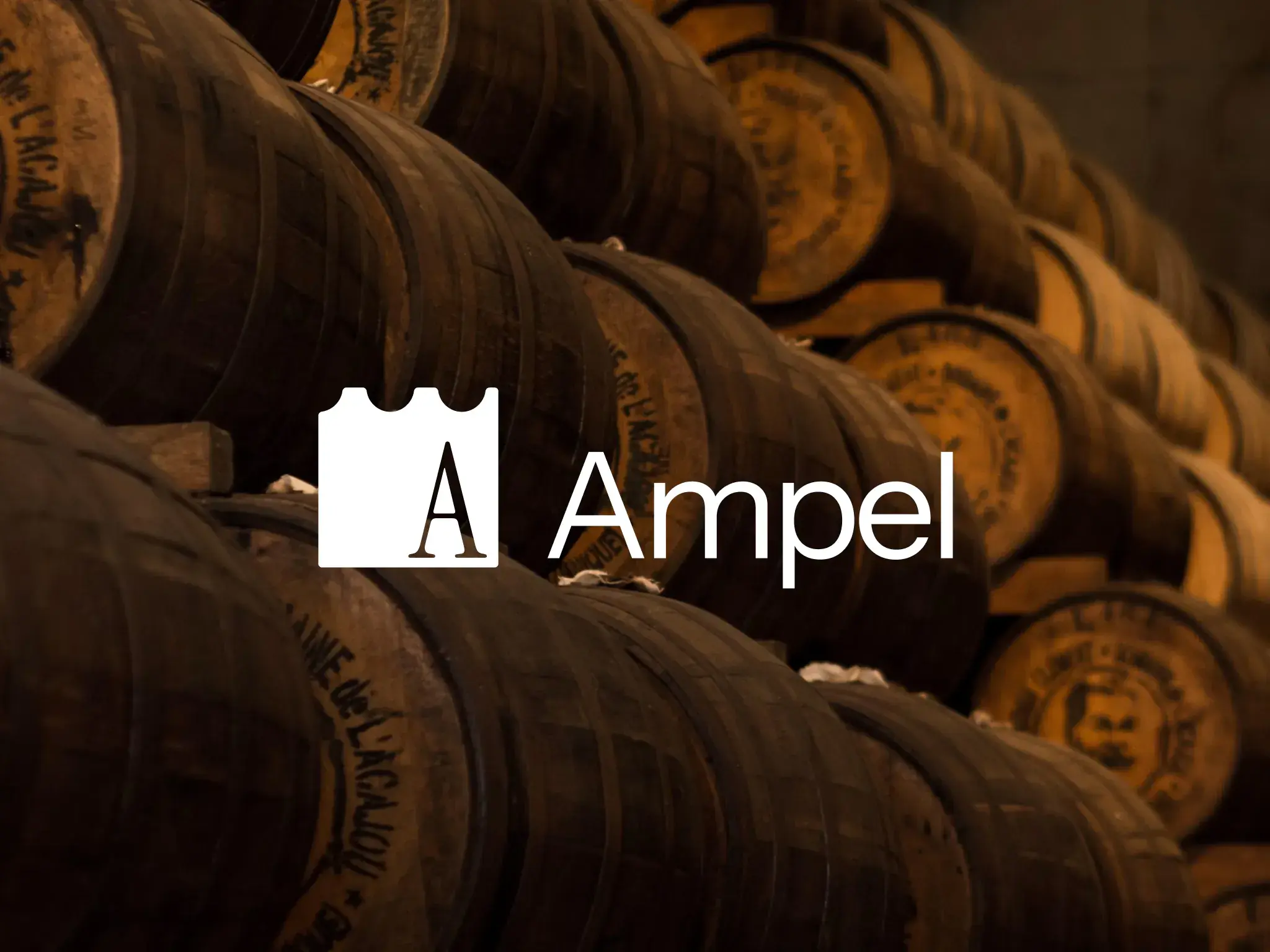 The Ampel logo in white over stacked oak barrels in a dim cellar